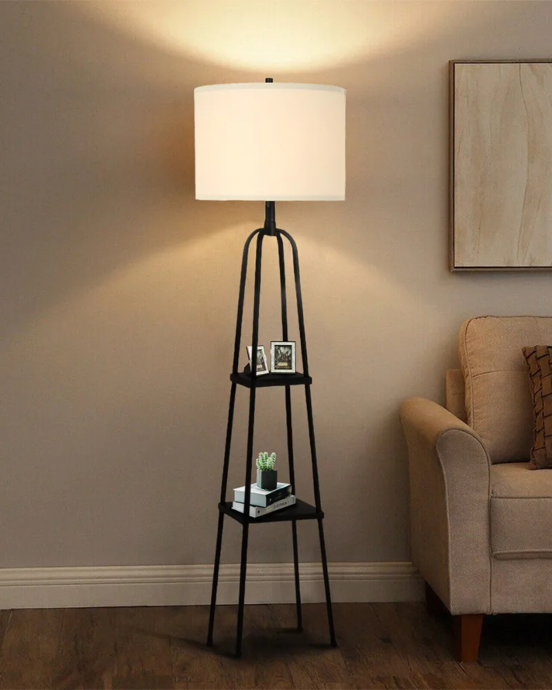 A black industrial floor lamp with built-in shelves from Dreamsidea, perfect for a cozy reading nook.