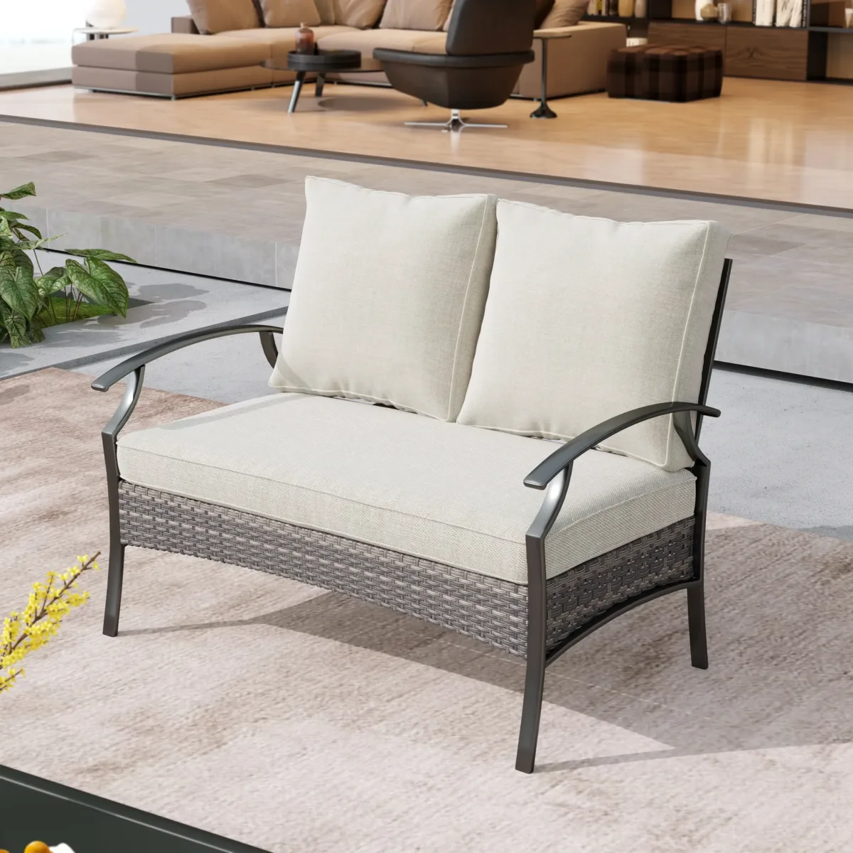 Charron Metal Outdoor Loveseat with Cushions and Wicker Decor - Image 1