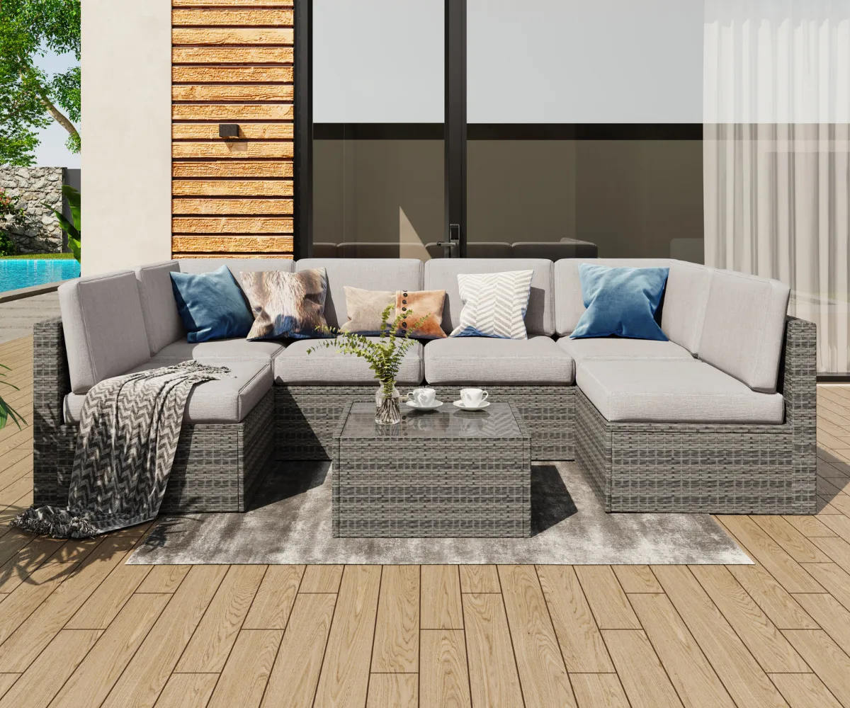 Dreamsidea's large, U-shaped wicker sectional sofa is set up for conversation on a sunny, poolside patio with a matching coffee table.